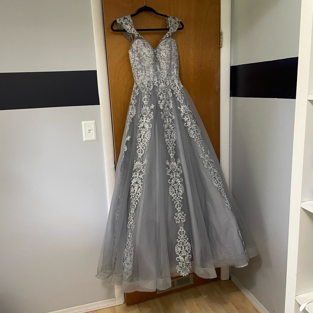 Silver ball gown, originally priced at $300 and professionally tailored for $145